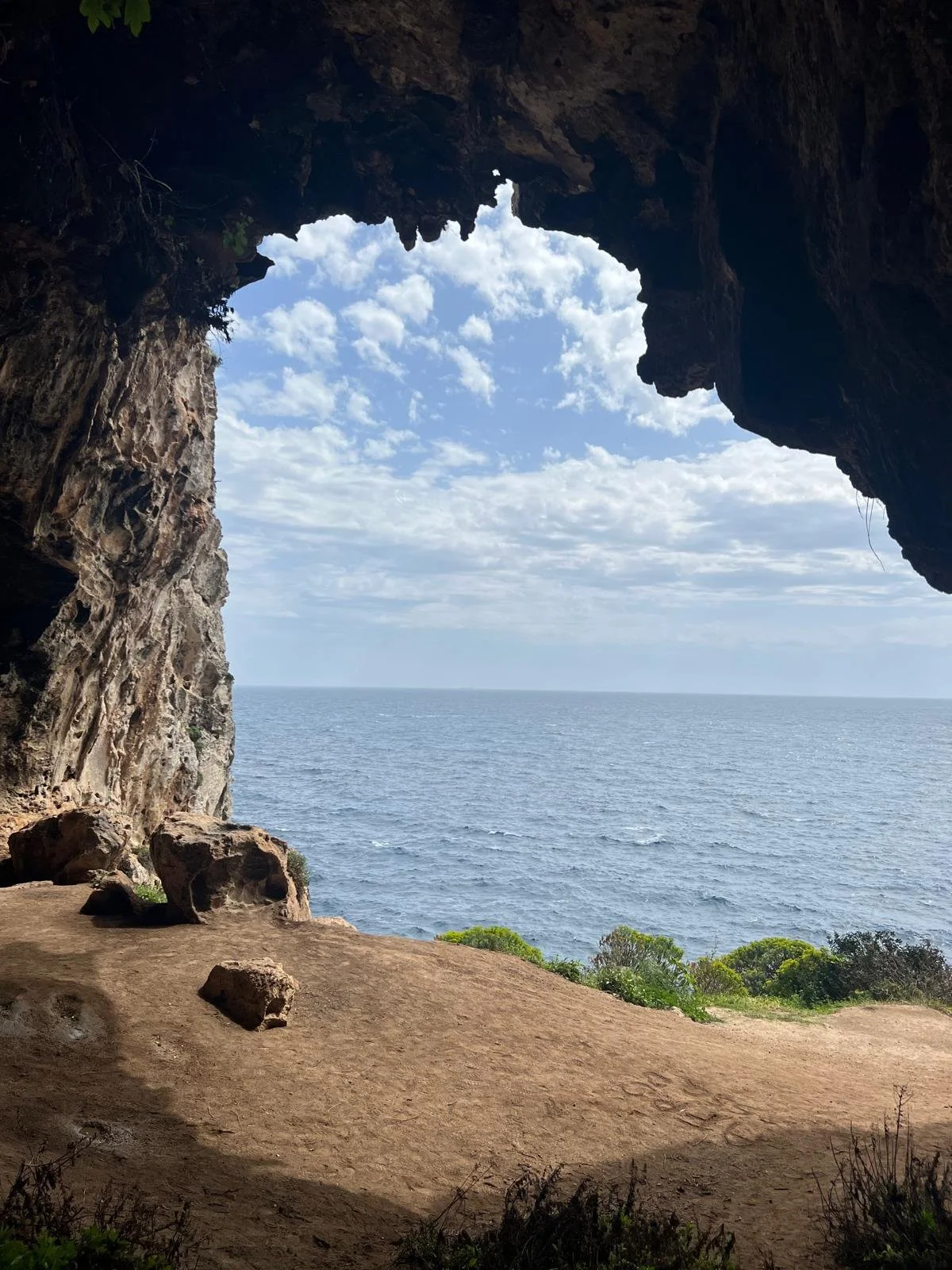 A breathtaking, exclusive view of the Adriatic Sea from within a natural sea cave in Polignano a Mare, Puglia. A bespoke luxury travel experience curated by Puglia Gateway for discerning clients from Sydney and New York.