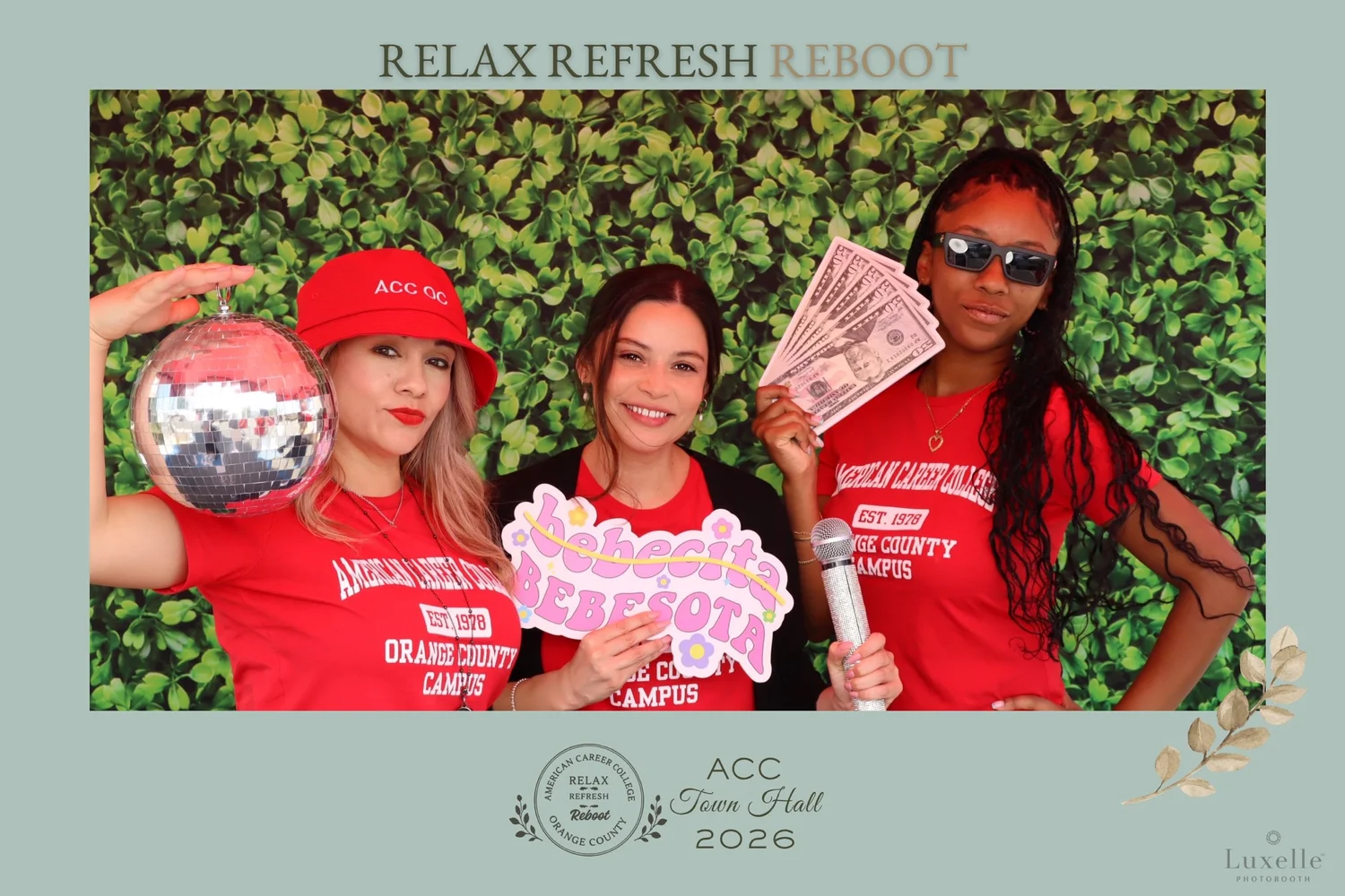 Three guests using props in an American Career College branded photo booth activation