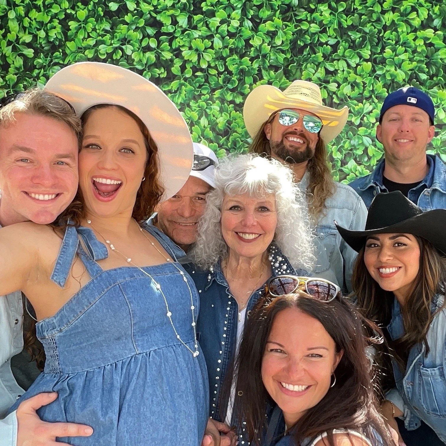 Guests celebrating at Jaclyn and Cory's baby shower with the Luxelle photo booth