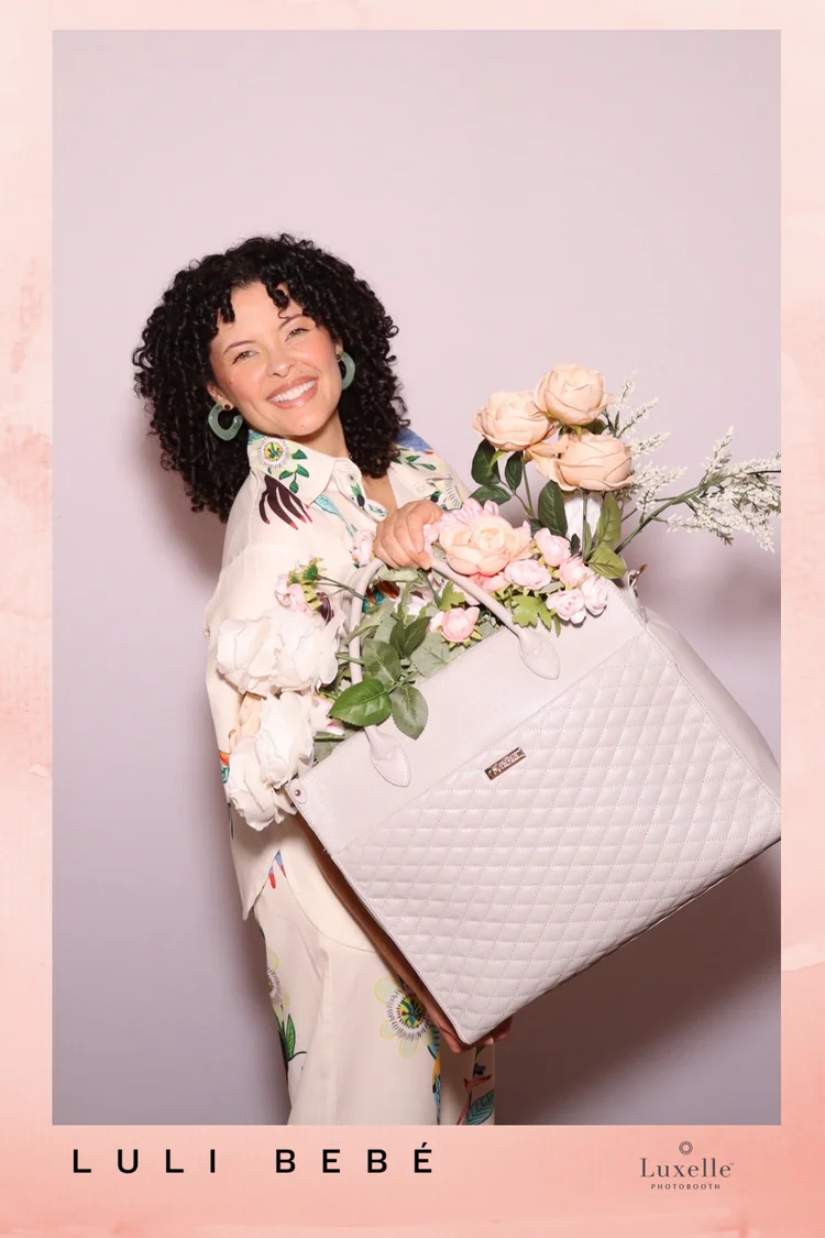 Branded product portrait of a Luli Bebé bag with flowers and a custom pink border, from a Mother's Day event at My Little Shop, The Americana at Brand