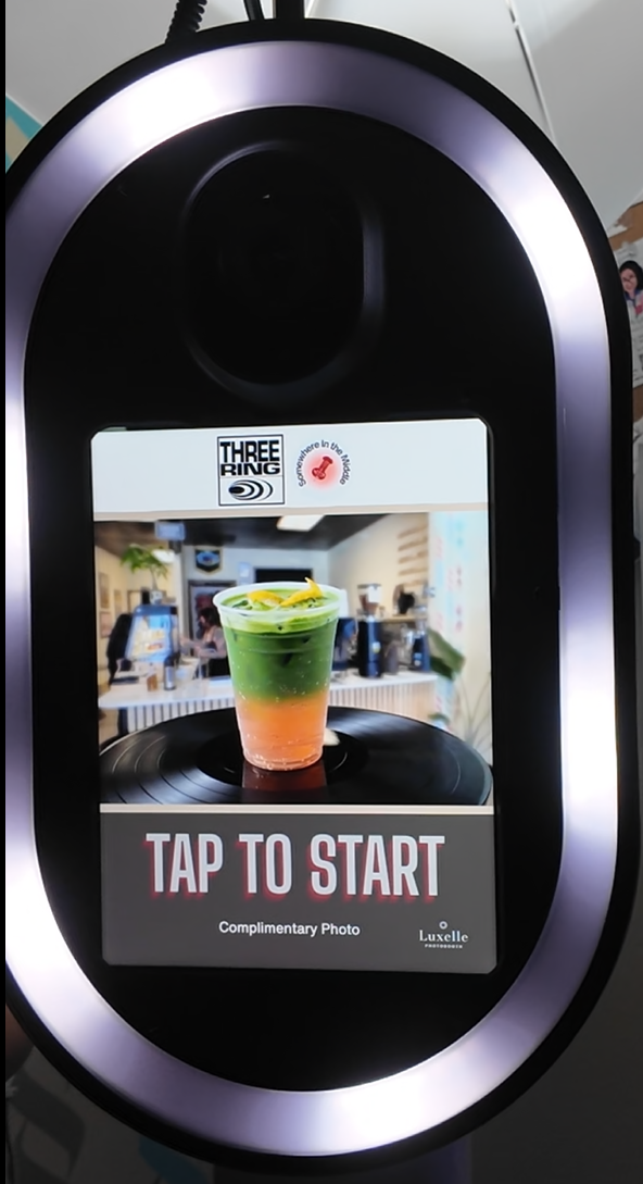 Animated Three Ring Coffee R&B Vinyl Night photo booth attract screen with event-specific motion graphics and a tap-to-start call to action