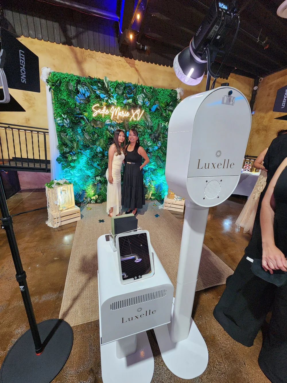 The Luxelle booth, backdrop and studio lighting set up at a quinceañera