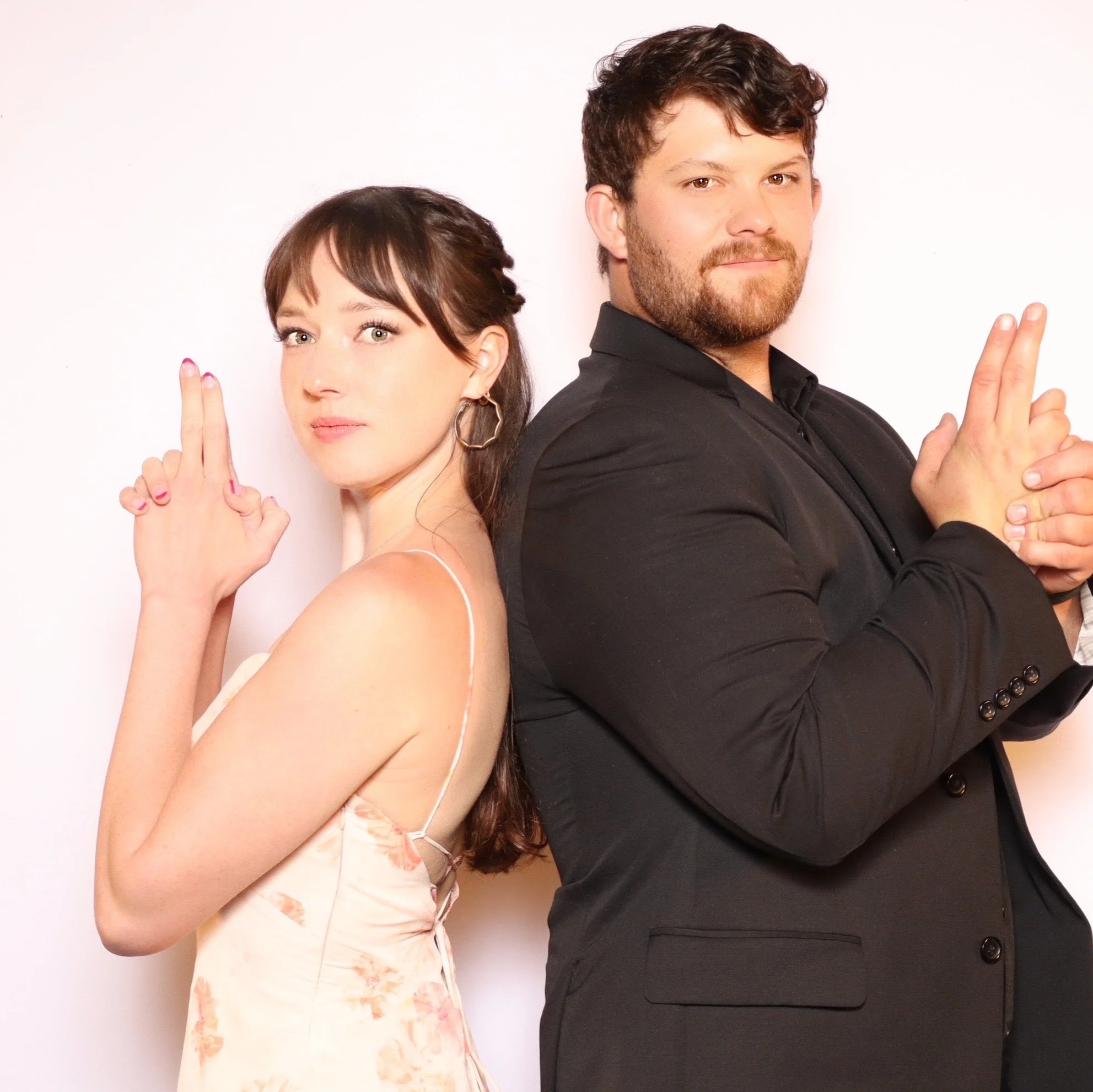 Wedding guests posing at the Luxelle photo booth during Julianna and Micah's reception