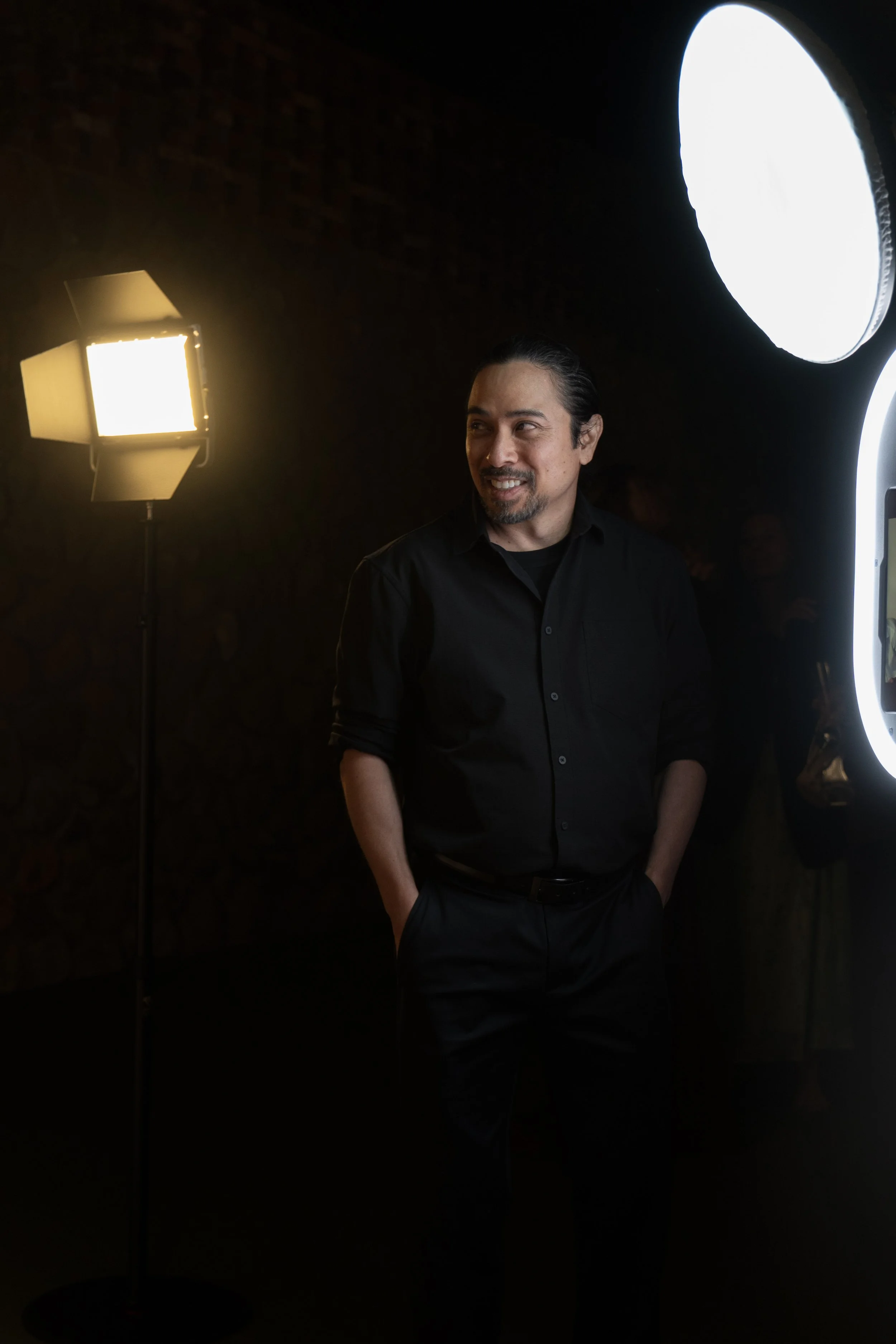 Phil, founder of Luxelle, standing beside photo booth lighting equipment