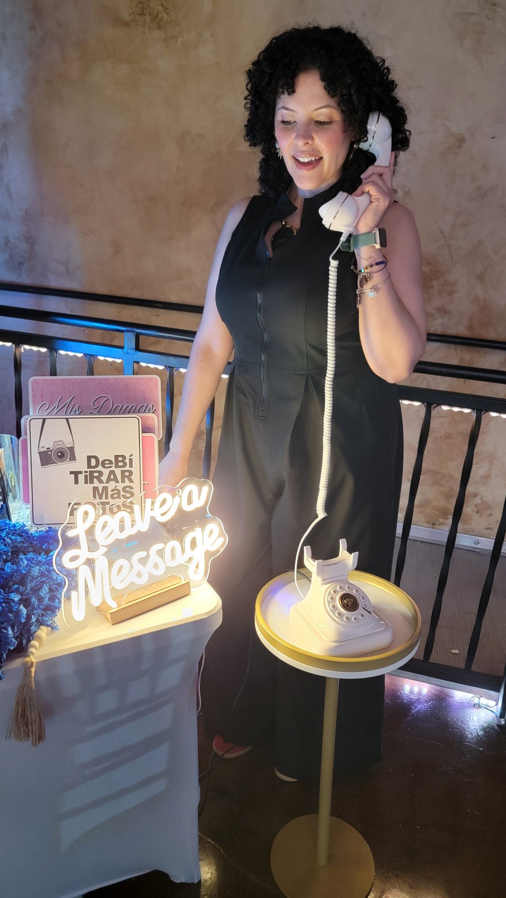 A guest leaving a voice message on the audio guestbook at a quinceañera