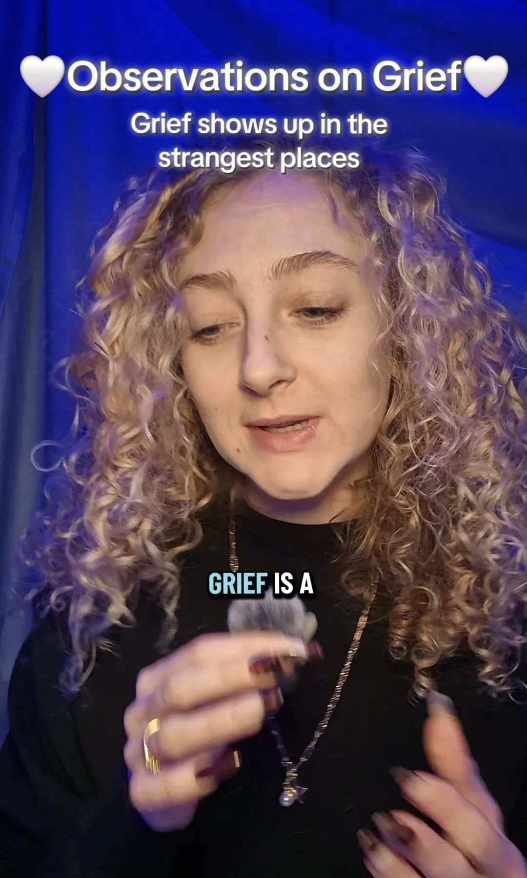 A woman with curly blonde hair holds a small object in her hand, with the text overlay stating 'Observations on Grief' and 'Grief shows up in the strangest places.'