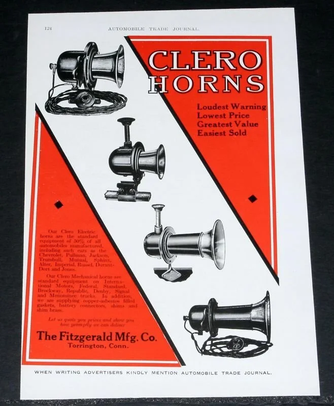 Advertisement for Clero Horns by The Fitzgerald Manufacturing Company featuring illustrations of vintage automobile horns with bold red and black design elements.