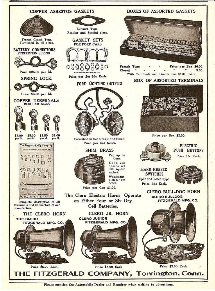 An advertisement for automotive accessories and gaskets, including copper asbestos gaskets, gasket sets for cars, gaskets, spark locks, terminal connectors, lighting outfits, brass shim cans, push buttons, switches, horns, and other related items from The Fitzgerald Company in Torrington, Connecticut.