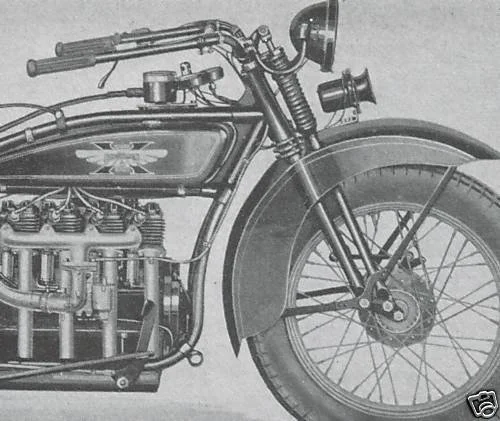 Black and white vintage motorcycle showing front wheel, front fork, part of the engine, handlebars, and headlight.