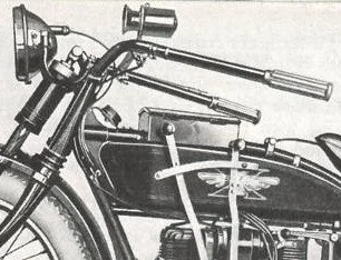 Close-up of a Henderson motorcycle handlebar, controls, and fuel tank in black and white.