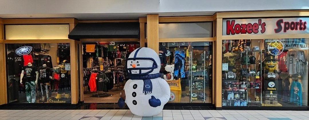 A toy snowman outside the store Kozee's Sports in a shopping mall.