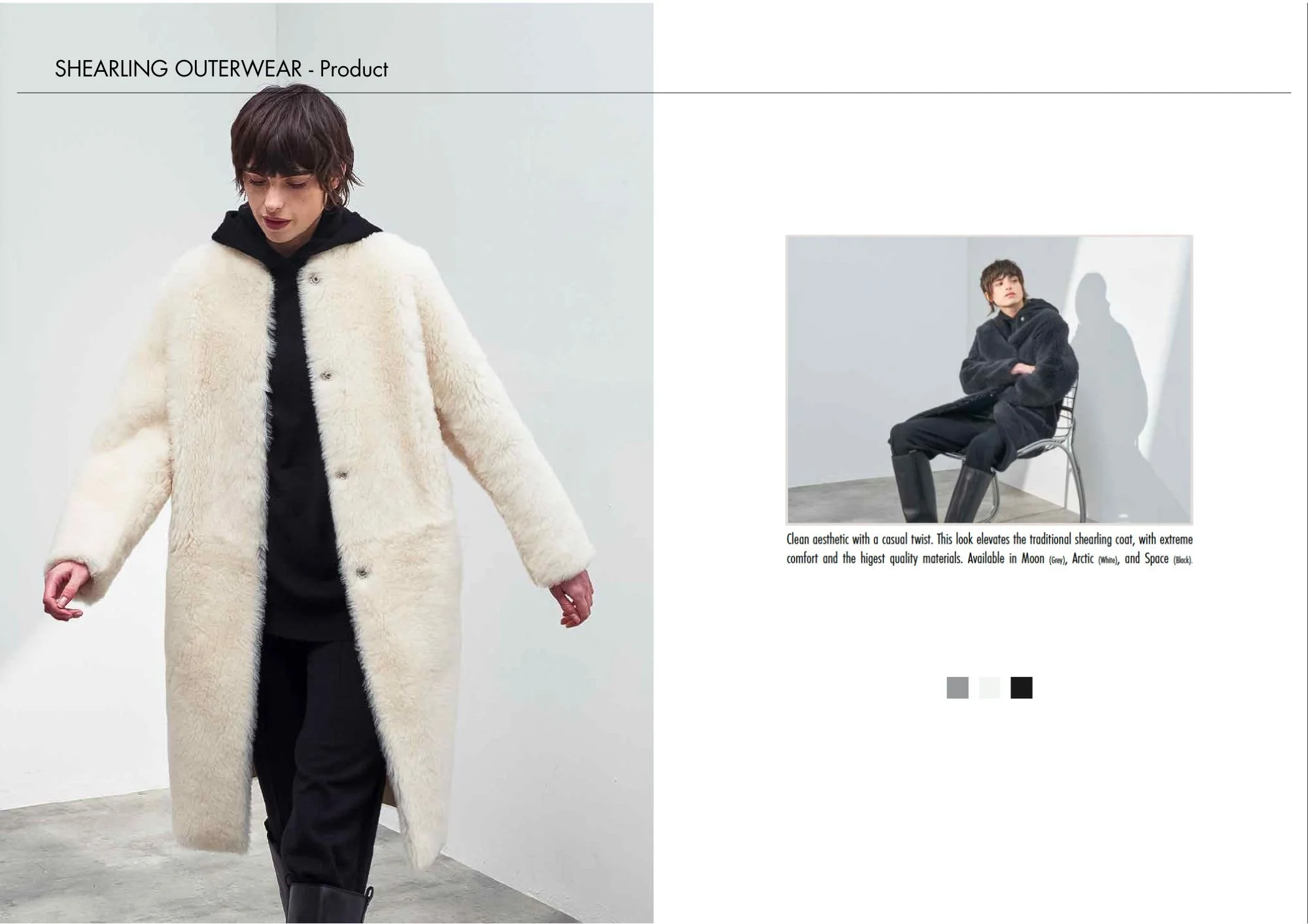 A person wearing a long, cream-colored shearing coat over black clothing, standing in a minimalistic white room.