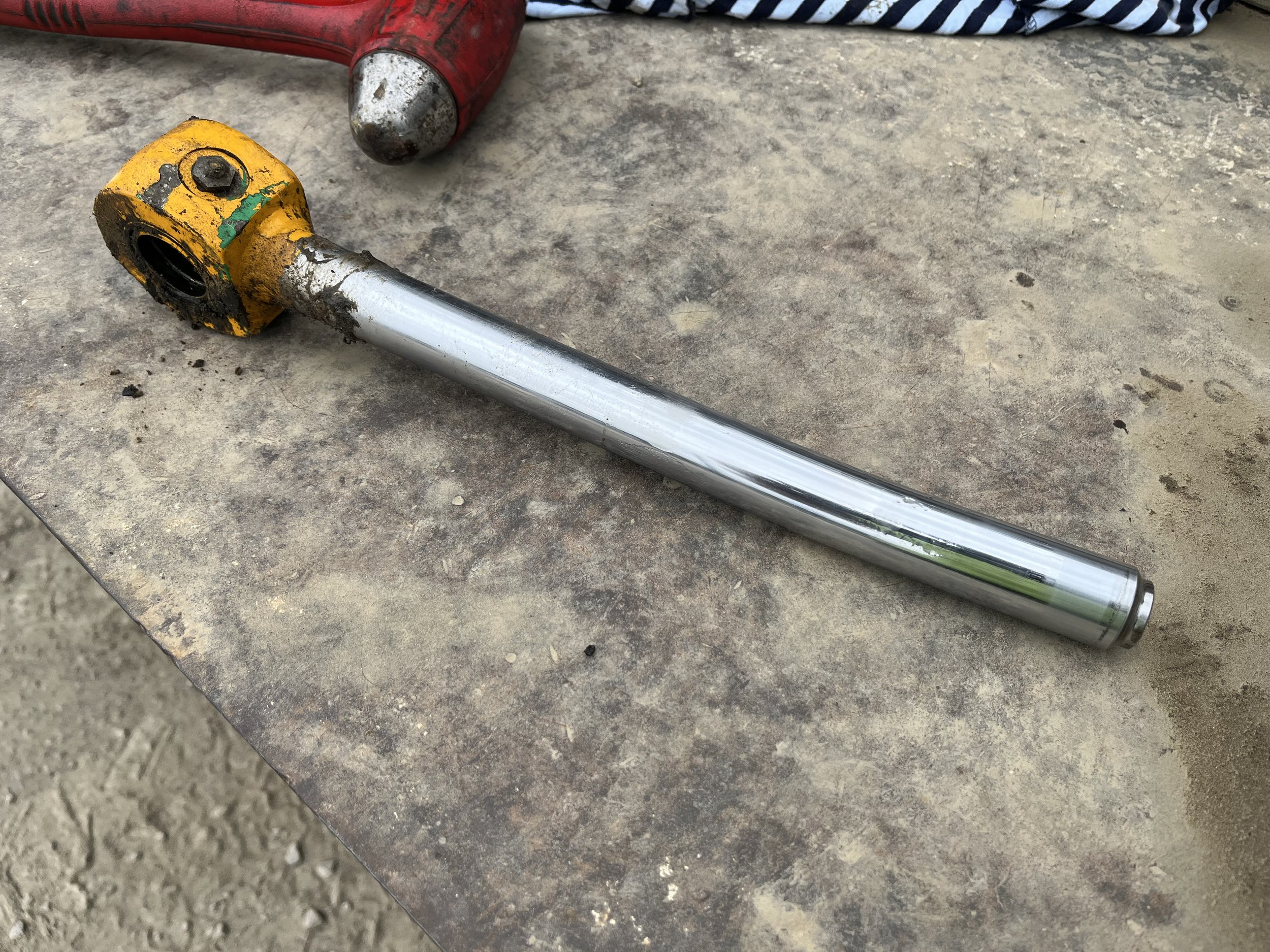 broken and bent hydraulic cylinder rod. disassembled to verify concern with machine