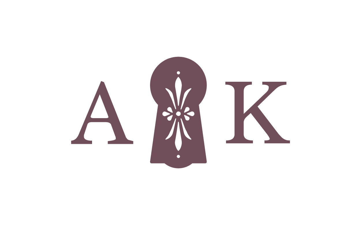 The image shows the word 'A' followed by a keyhole shape with an ornamental pattern inside, then the letter 'K'.