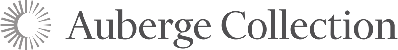 The image contains the Auberge Collection logo with stylized text and a circular sunburst icon.