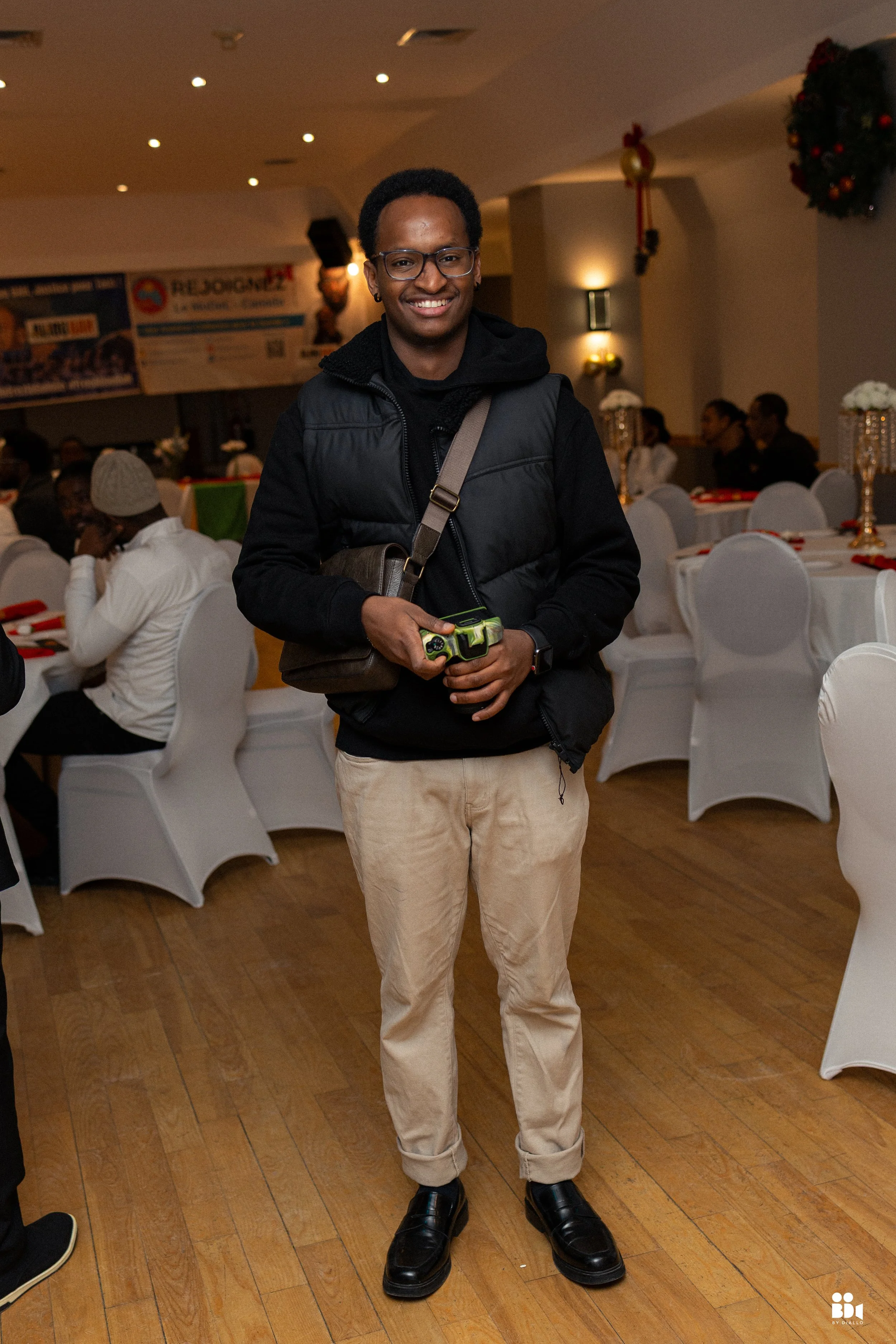 Behind-the-scenes moment of a photographer at an event in Montreal before a studio portrait session