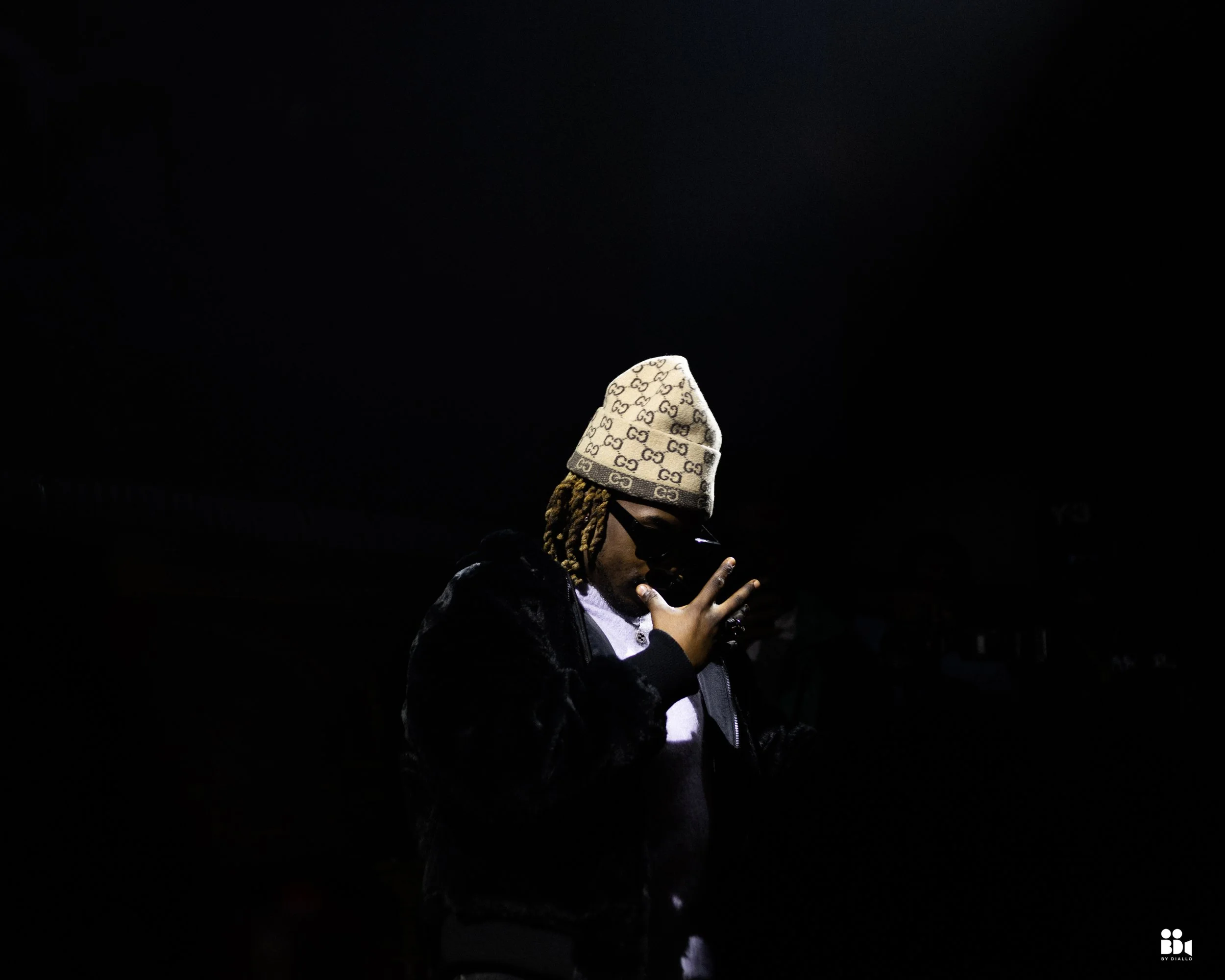 Close-up cinematic photo of an artist performing live at a showcase event, highlighting emotion, focus, and connection.