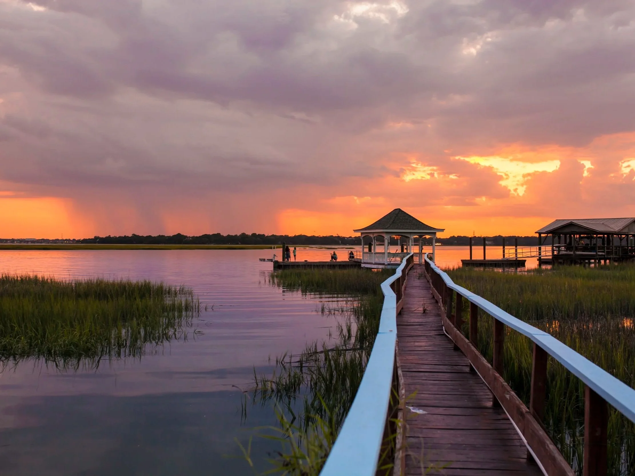 family-on-dock-at-sunset-2021-08-26-16-22-43-utc.jpg
