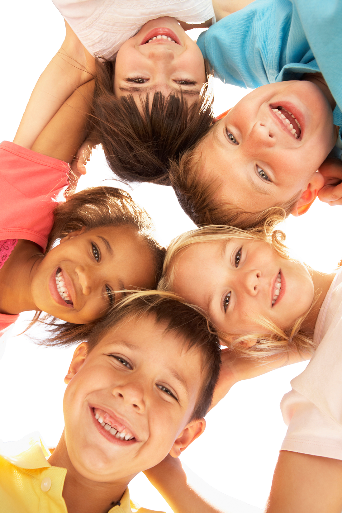 Group of children lying in a circle, smiling and looking up at the camera