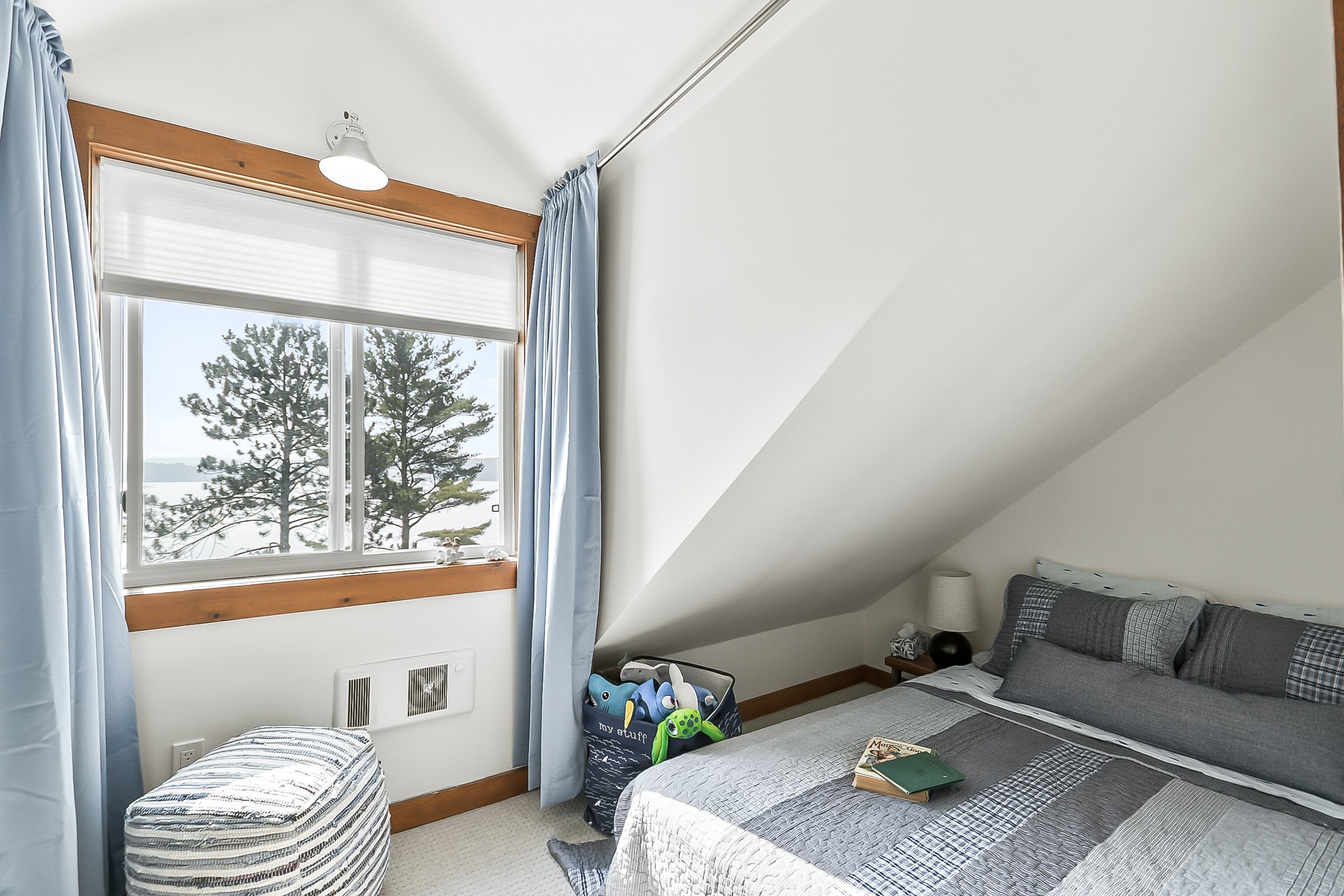 The Dormer Room: Double bed with shared bath on the second floor in the main cottage, with lake views.