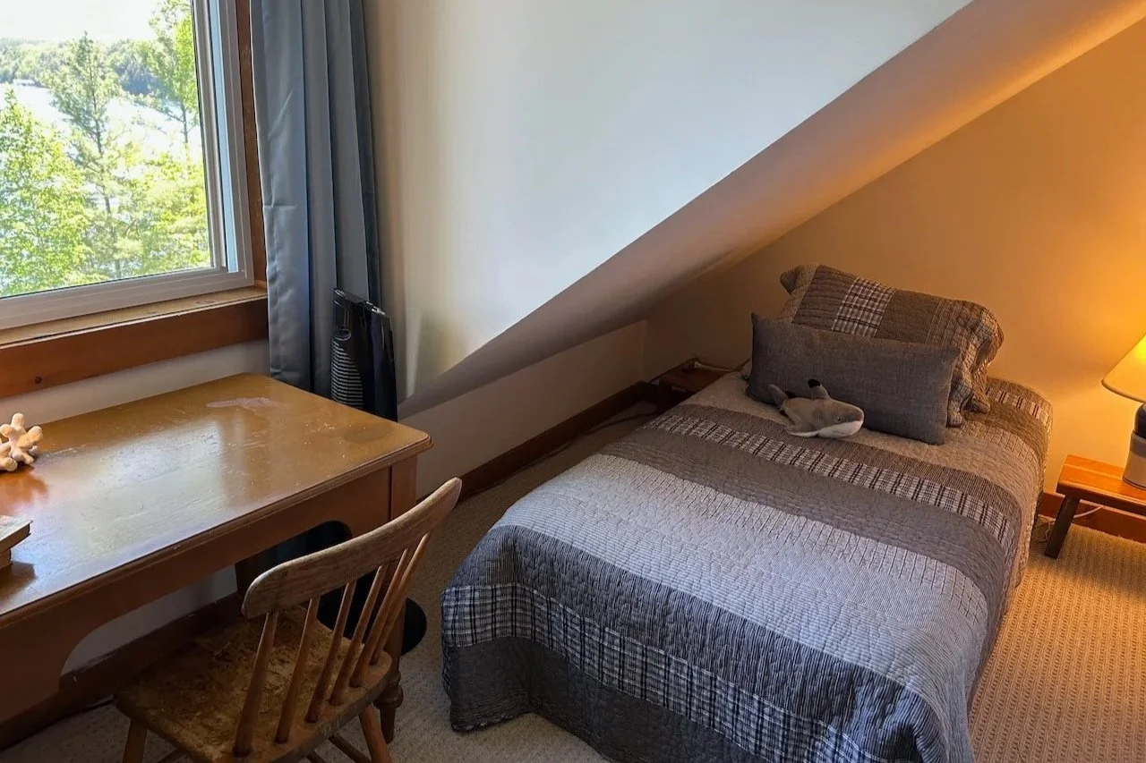 The Dormer Room: Twin bed with shared bath on the second floor in the main cottage, with lake views. Best desk in the cottage!