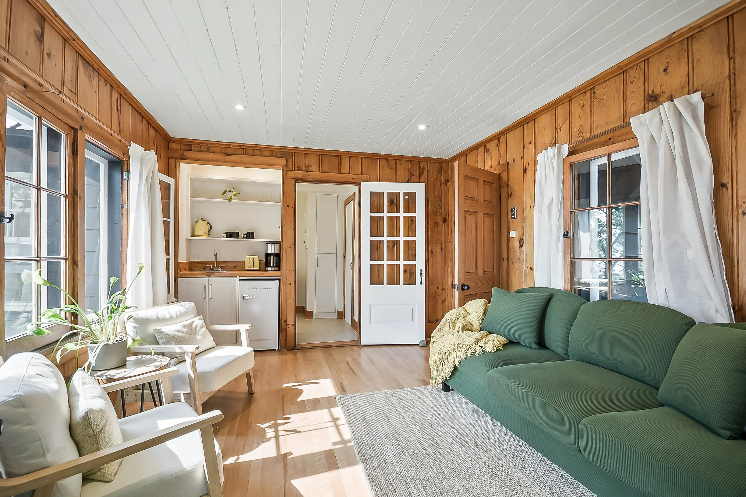 Living area in private cabin with sofa bed