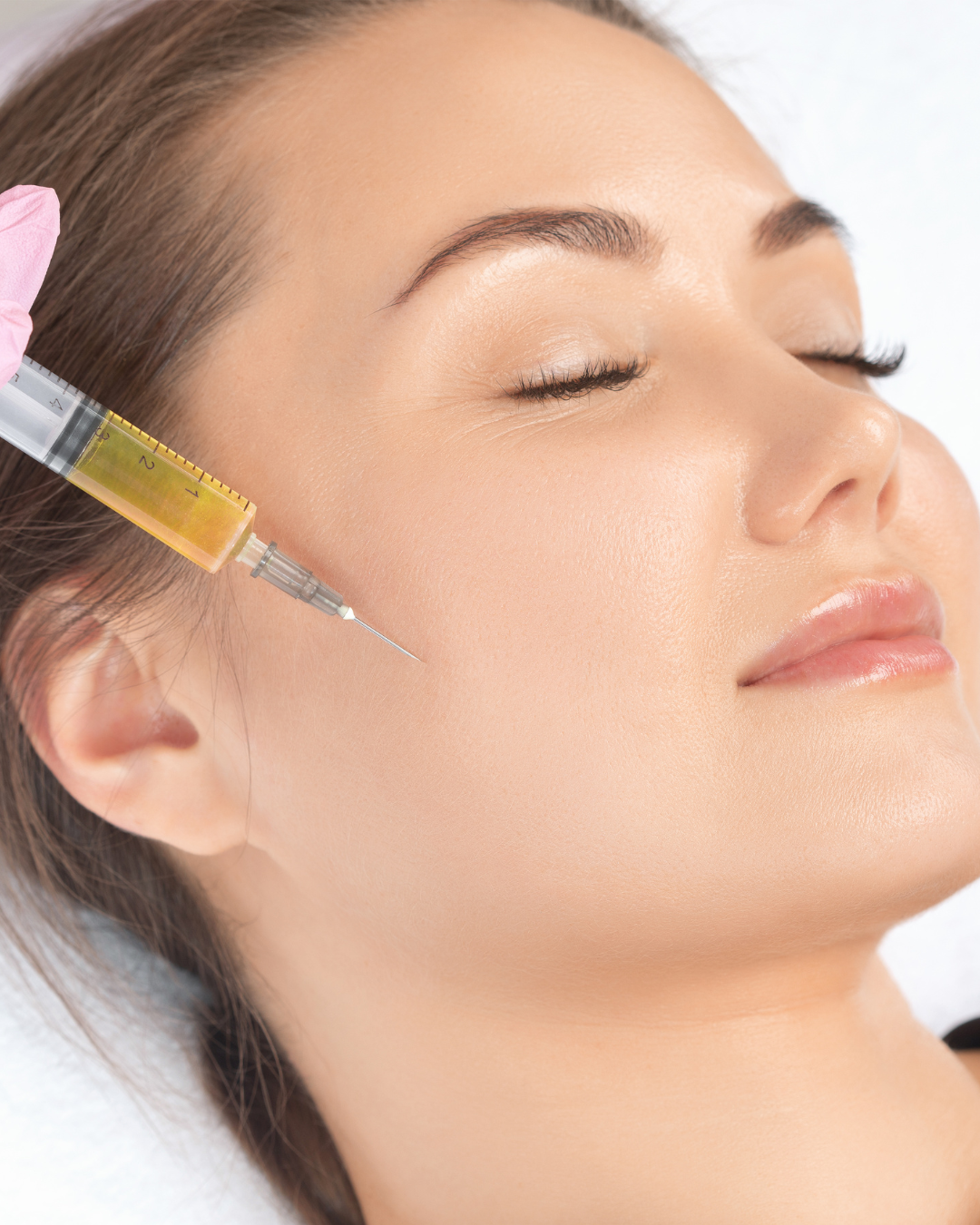 a model receiving a prp injection in her cheeks