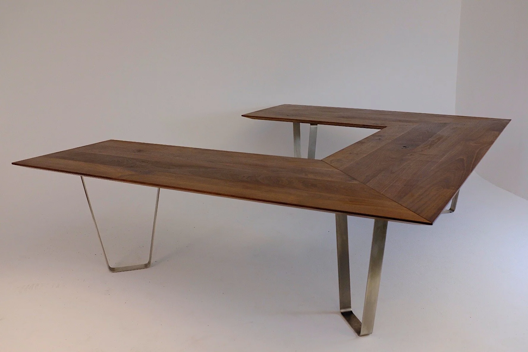 Modern wooden desk with metal legs in a Minimalist style.