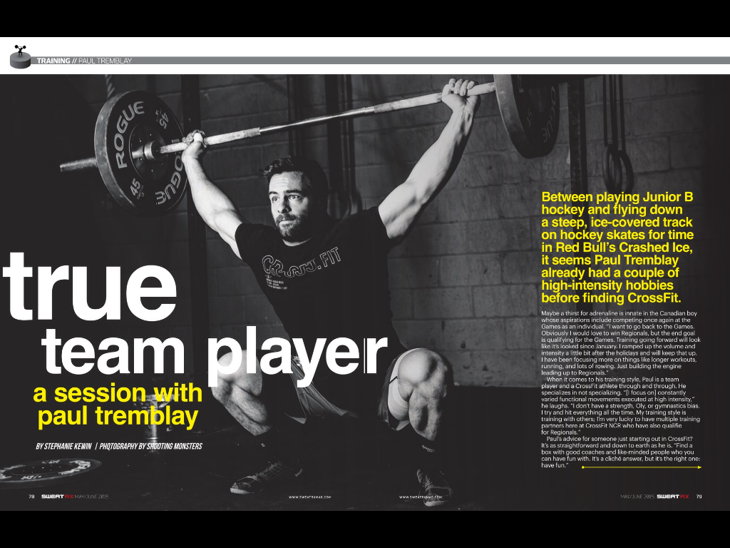 man with barbell over his head doing olympic lift snatch. athlete reebok sponsored. low key studio light off to side to create shadow. editorial piece for magazine on professional athlete 