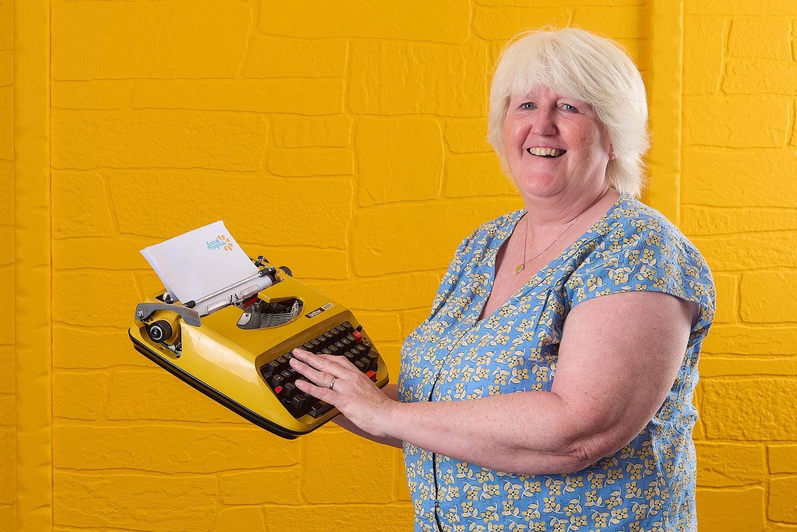 fun-corporate-head-shot-with-prop-social-progress-honley.jpg