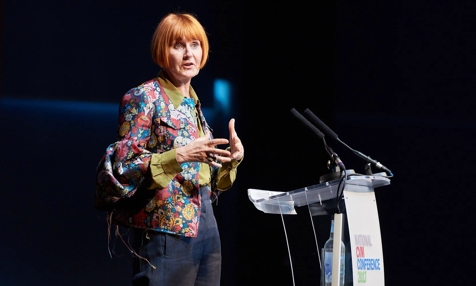 Event host presenting on stage at business awards night Mary Portas