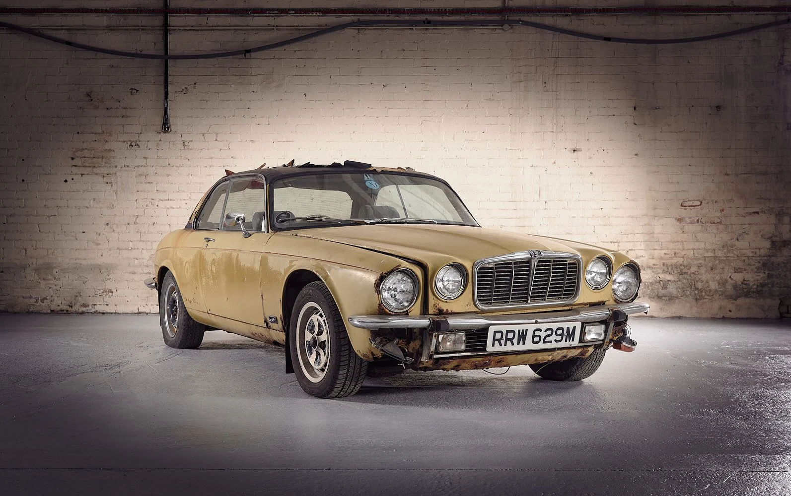 Vintage Jaguar car photographed on location with natural backdrop