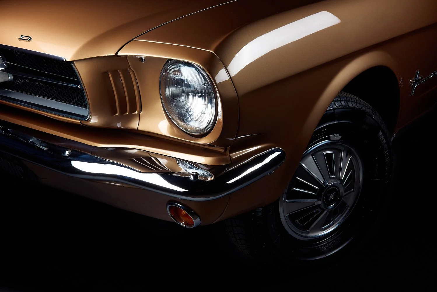 Car headlight lens photographed with dramatic lighting Ford Mustang Huddersfield