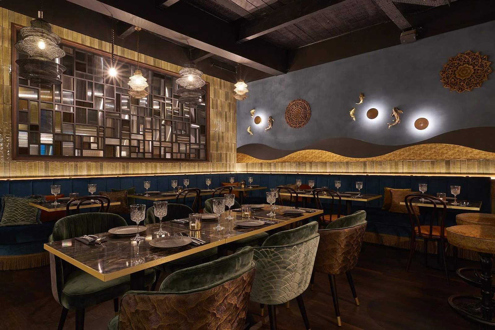 Luxury restaurant ambience with atmospheric lighting at Rambuttri Leeds