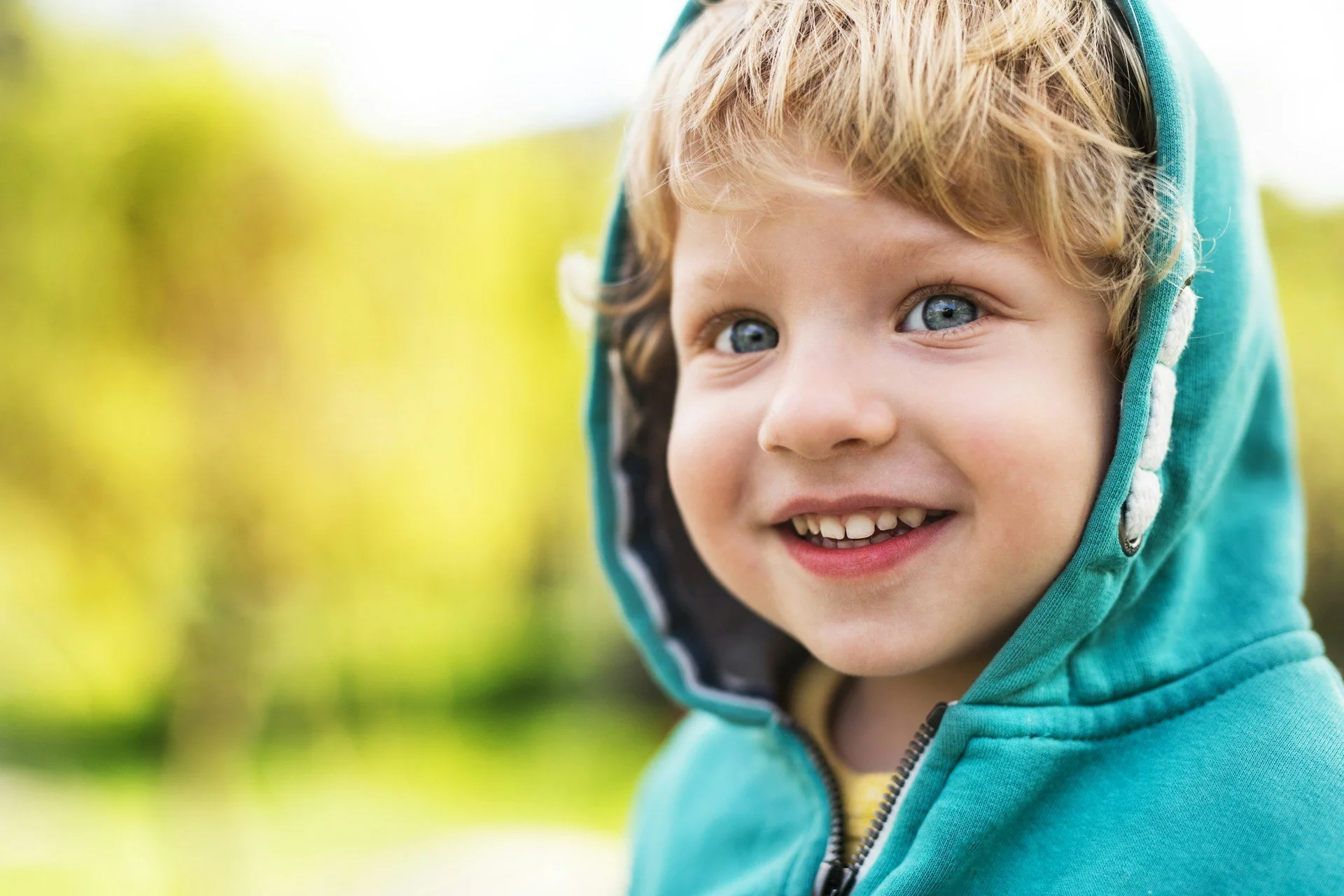 Child smiling confidently representing growth and recovery after selective mutism treatment in Ogden Utah