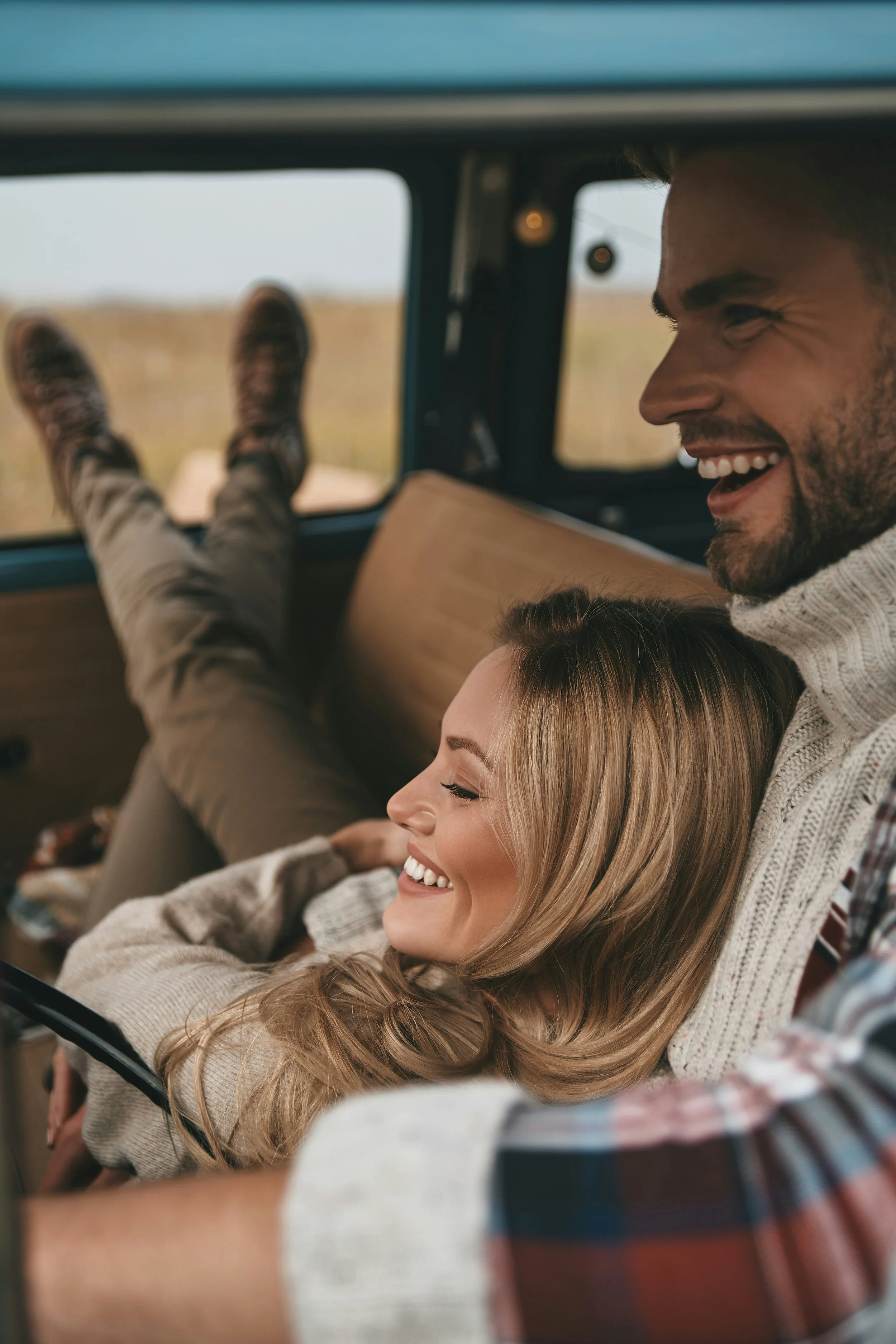 Man and woman sitting in a van representing freedom and improved daily functioning after OCD treatment in Ogden Utah