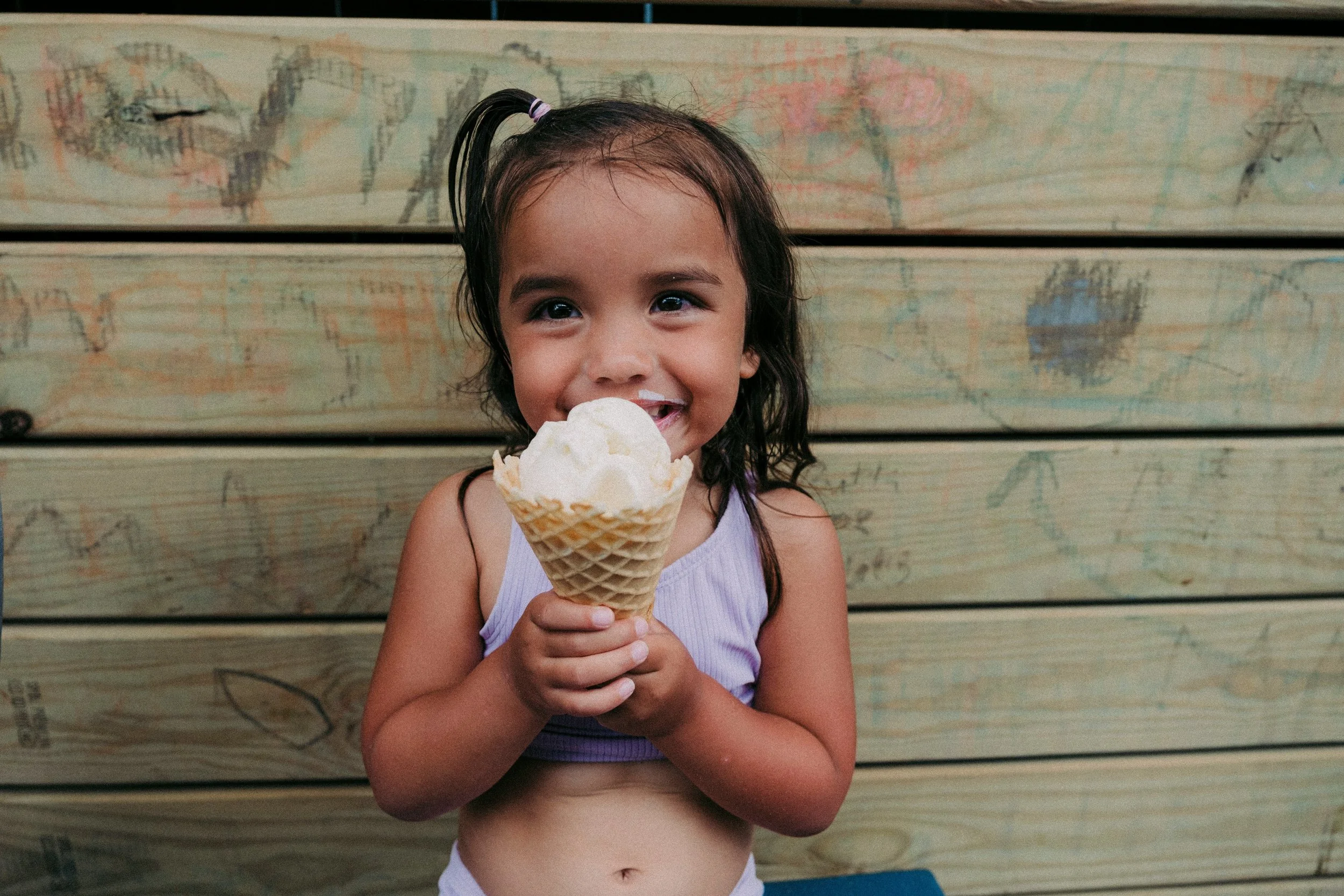 child eating an ice cream cone