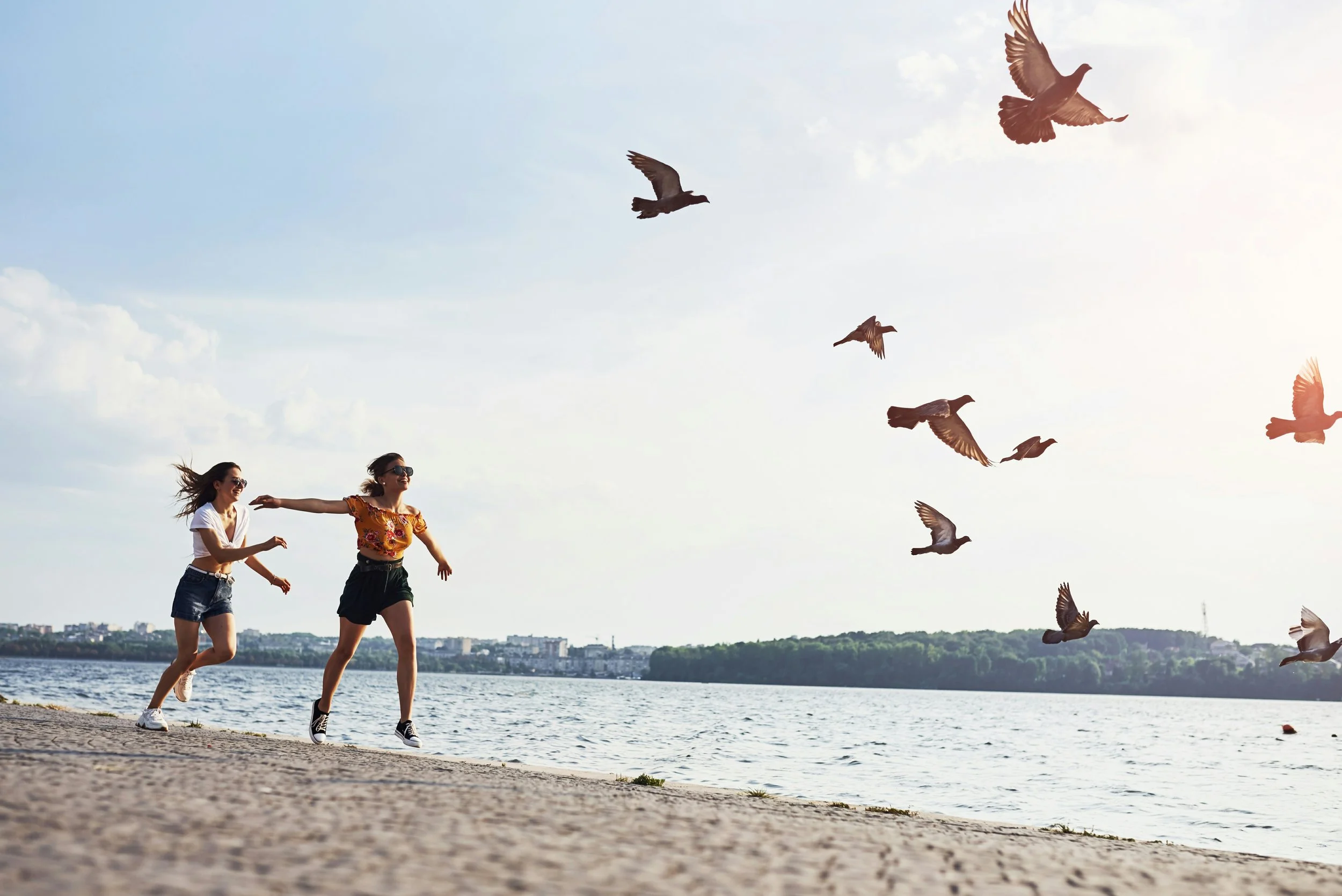 two women running on the beach
