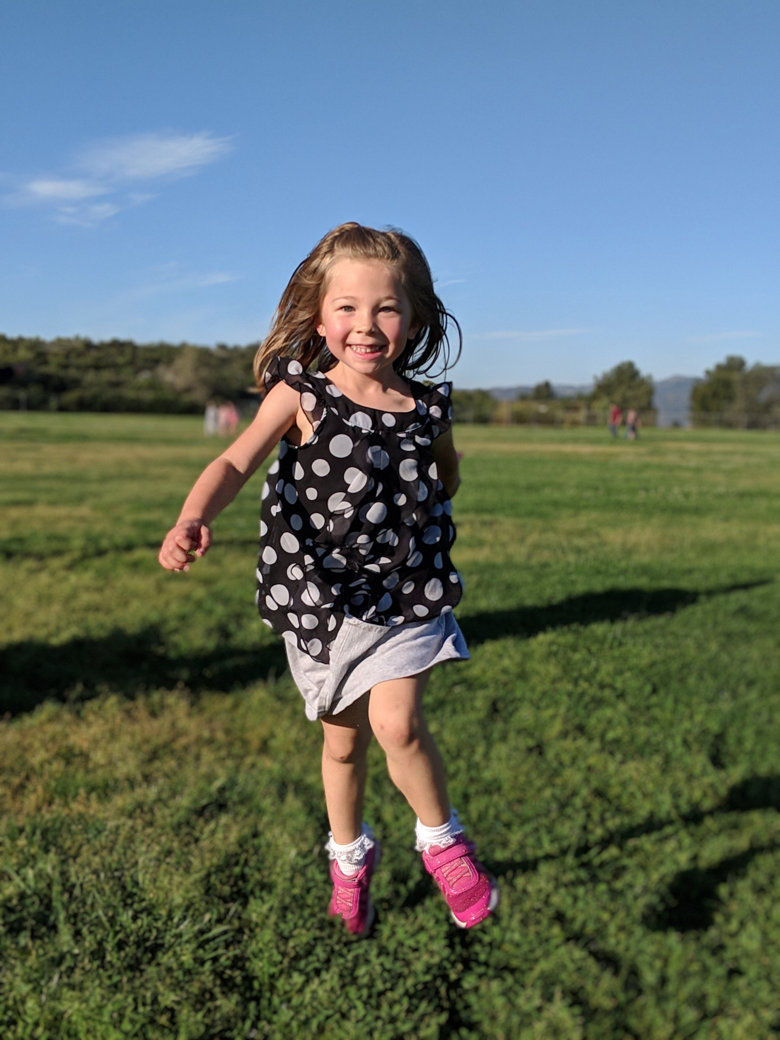 Girl running confidently after treatment for selective mutism in Ogden Utah
