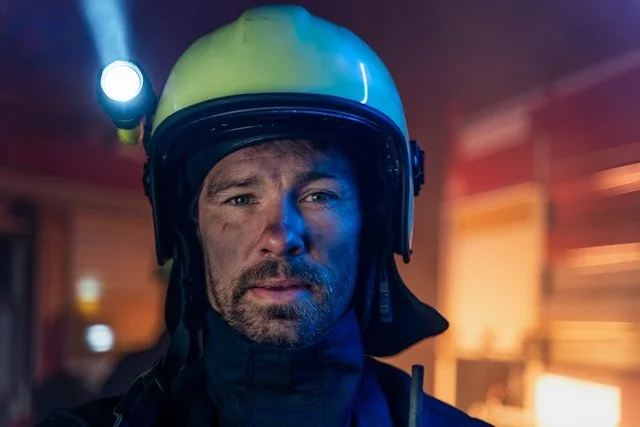 Firefighter with soot on face representing first responder trauma and PTSD recovery in Ogden Utah