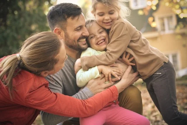 family in a group hug