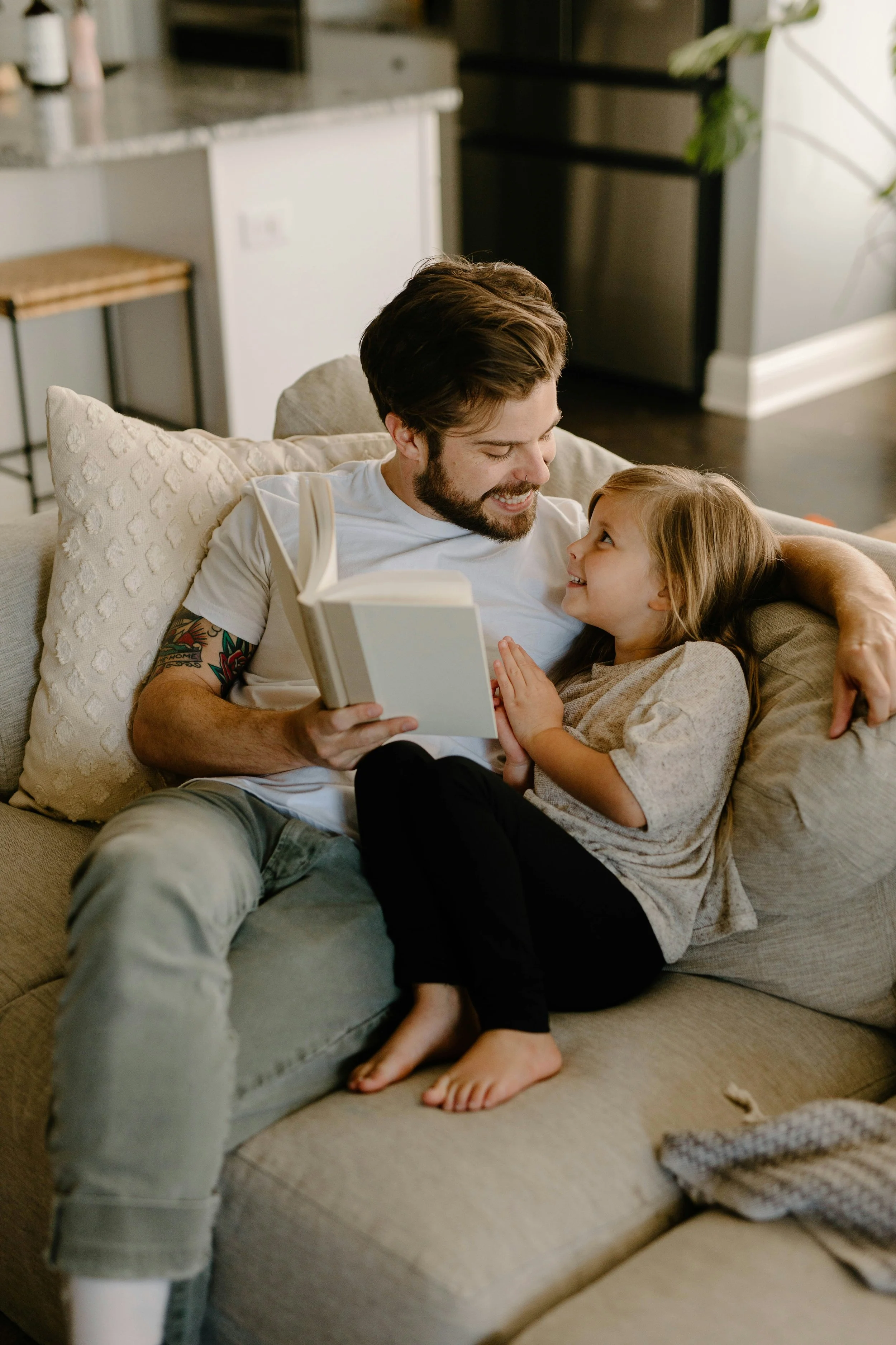 father and daughter reading together
