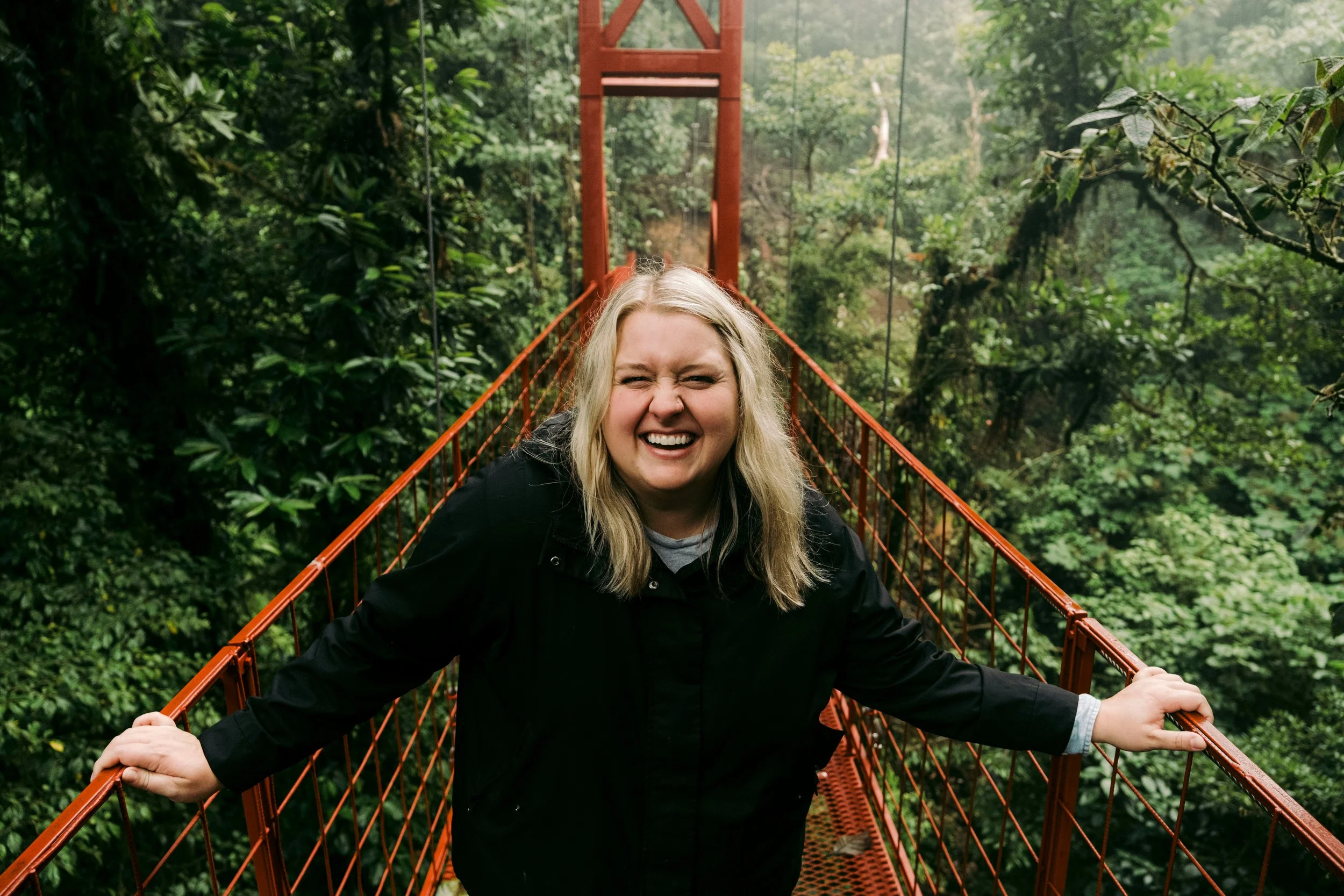 Woman smiling confidently outdoors after treatment for anxiety and depression in Ogden Utah