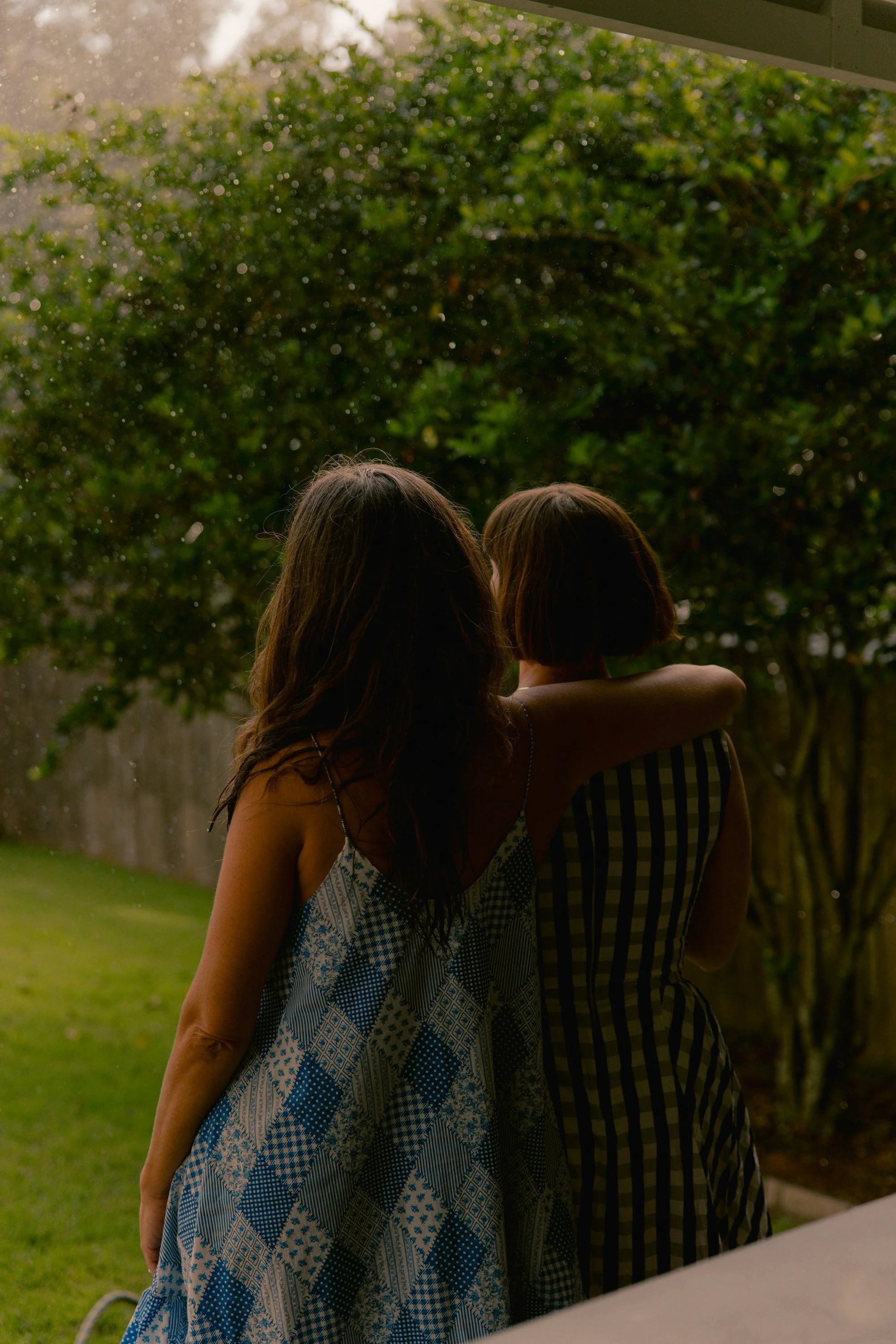 woman with arm around another woman