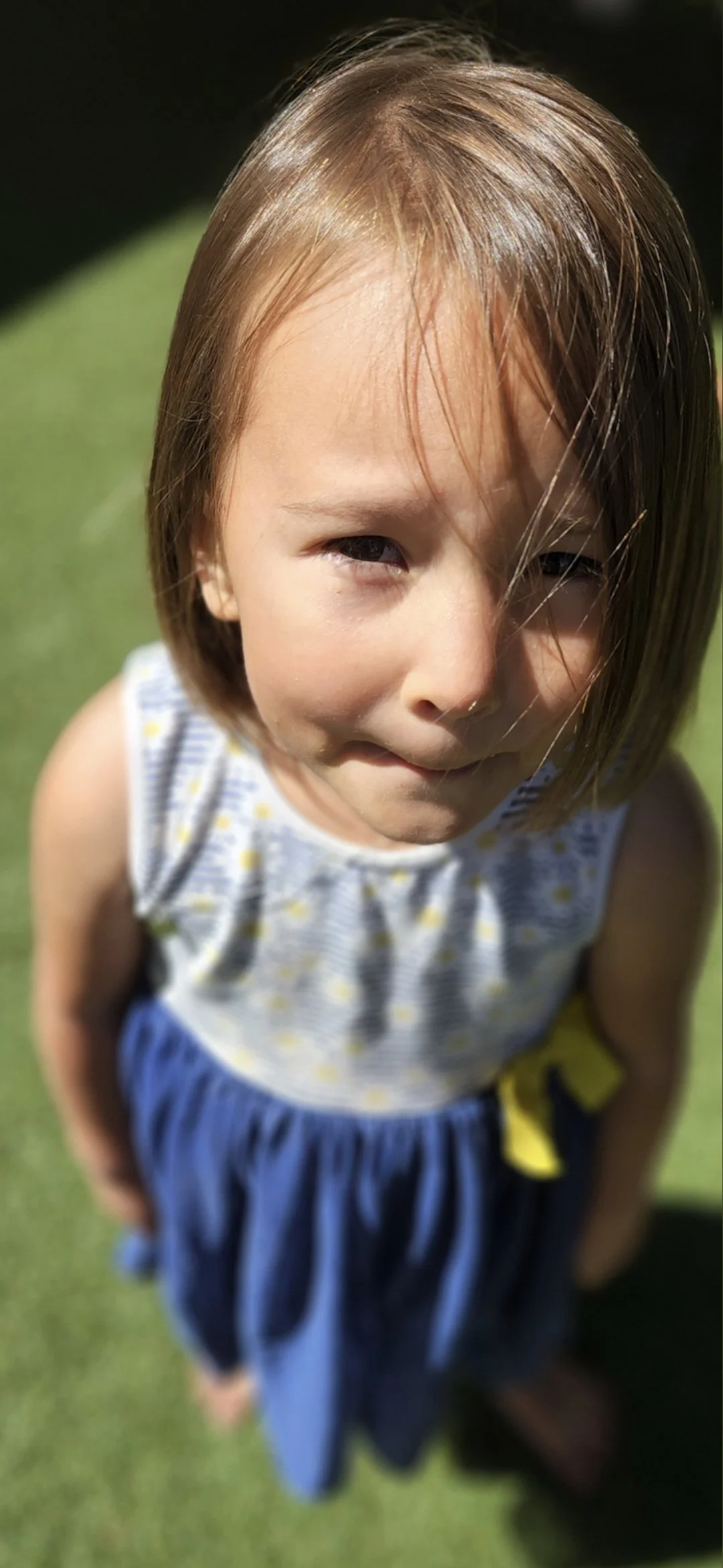 child squeezing their mouth shut