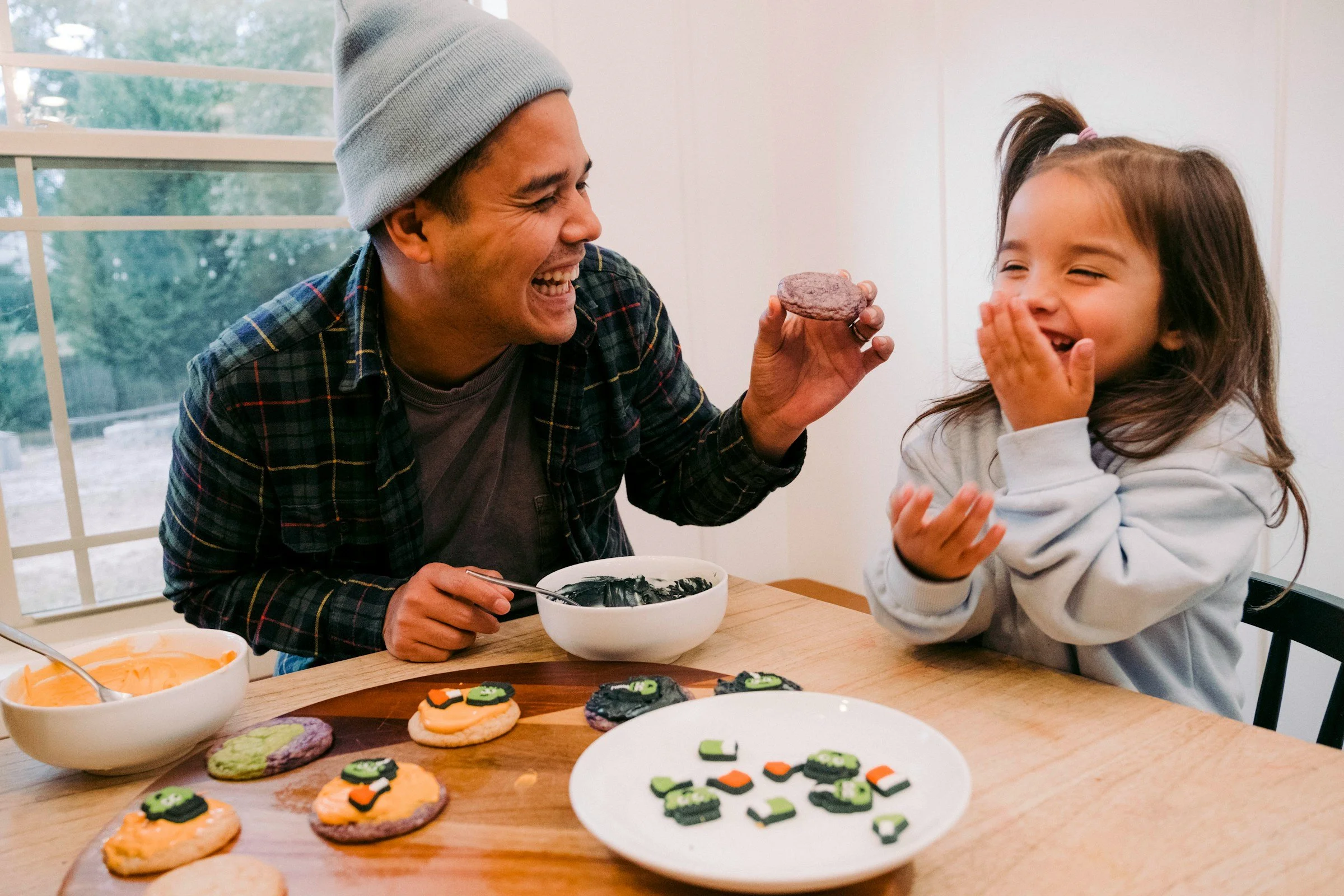 Man holding a cookie representing enjoyment and improved mood after depression treatment in Ogden Utah