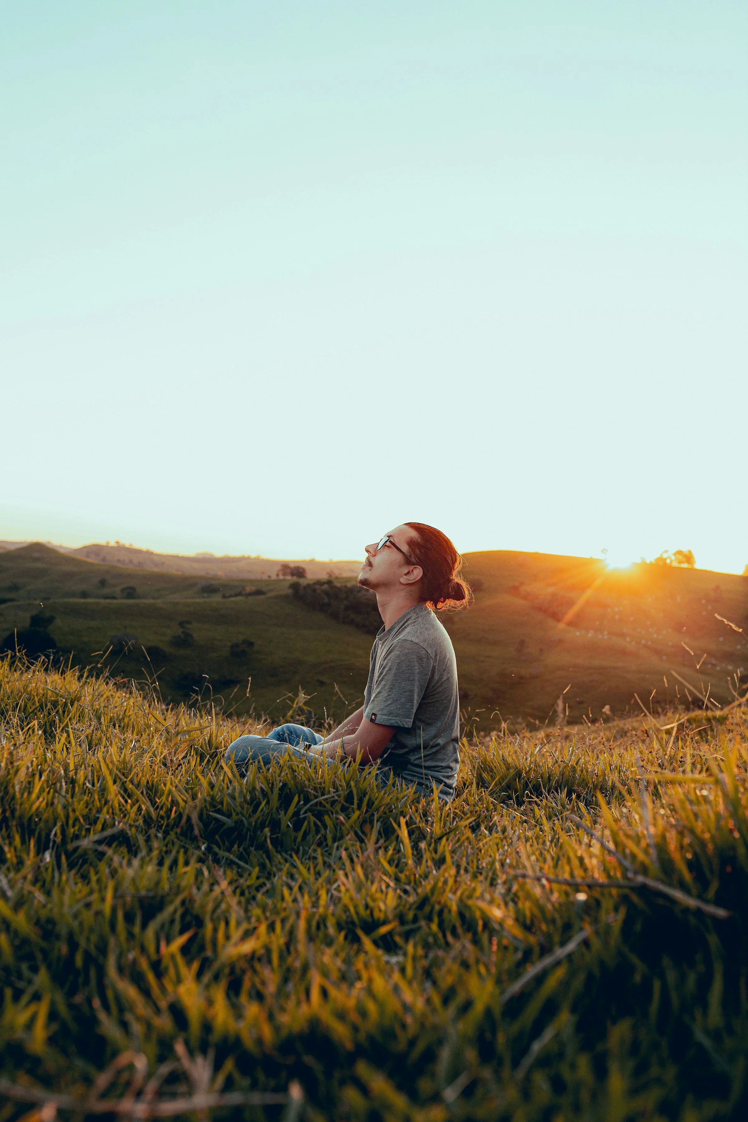 man sitting in a field