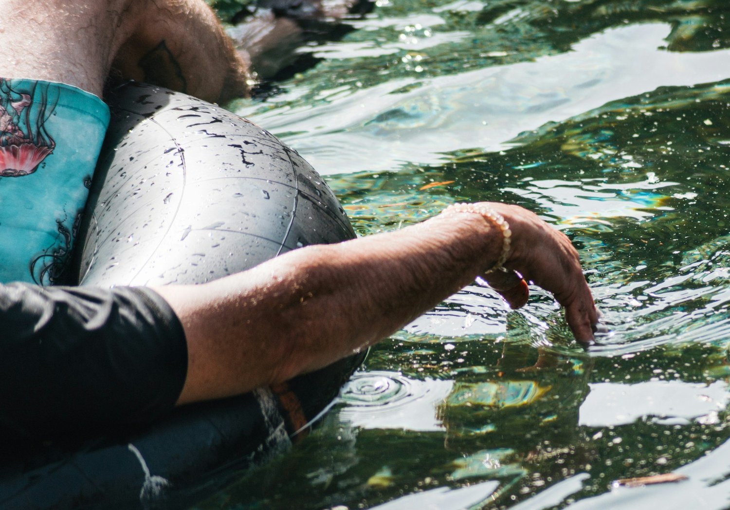 Man floating calmly in a river representing relief from anxiety in Ogden Utah