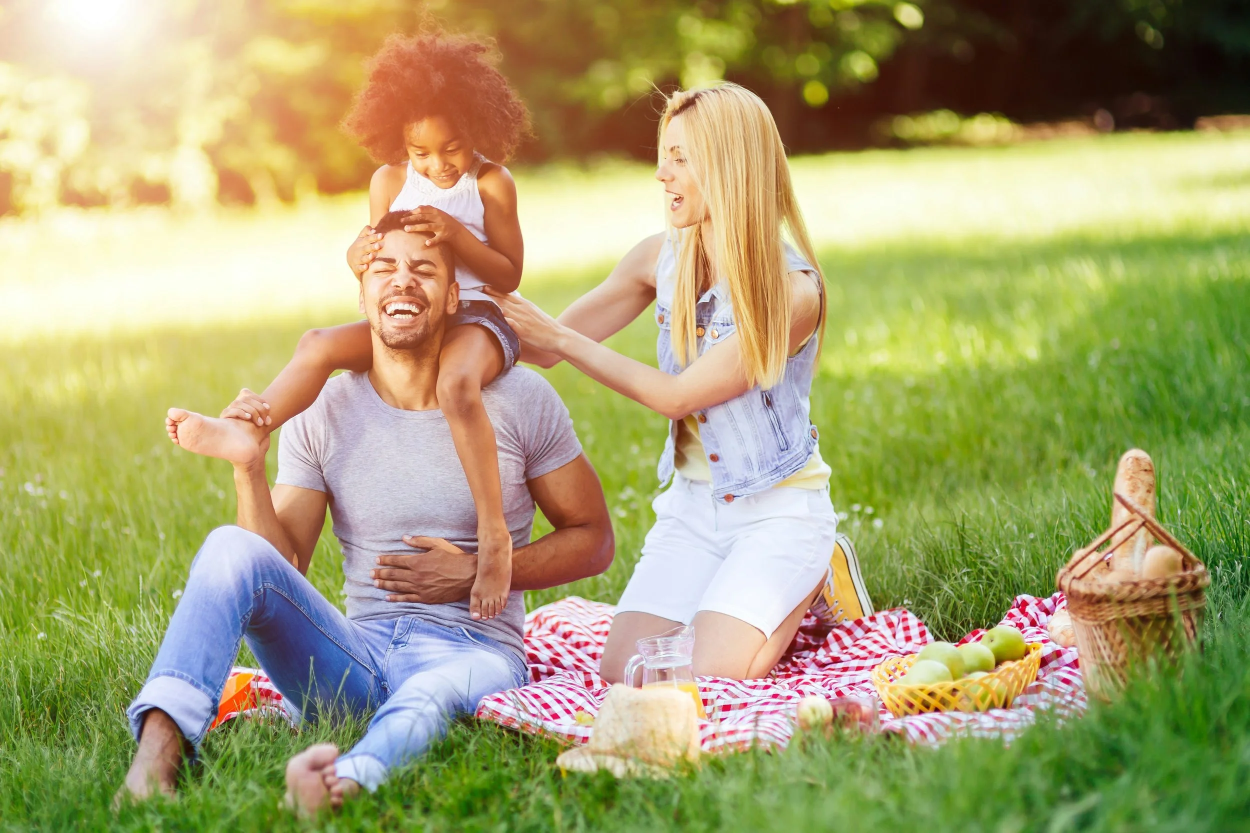 Family participating in outdoor therapy session in a park in Ogden Utah focused on child and adolescent mental health