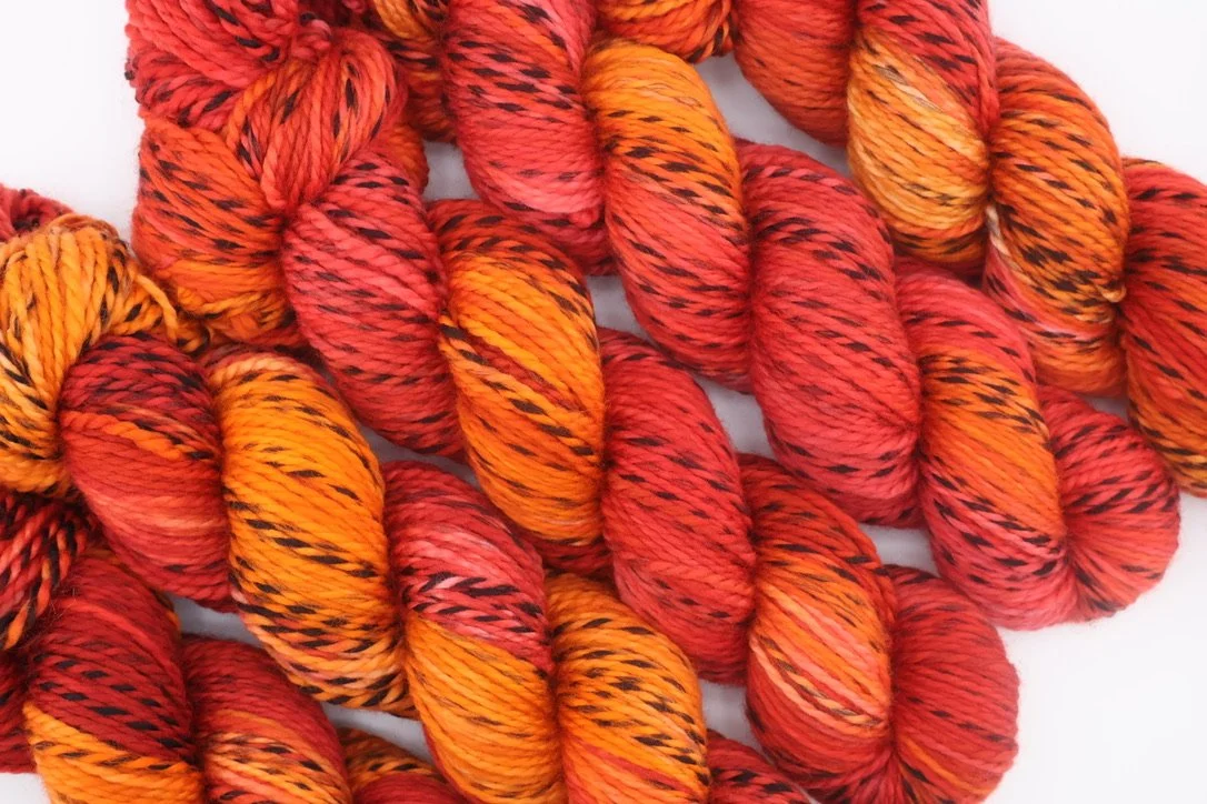 Barbour Brigade colourway – shades of red and orange hand‑dyed Zebra 100% merino DK yar
